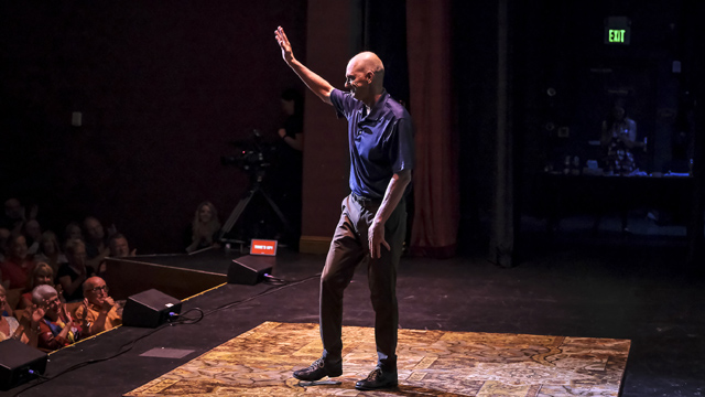 Rowdy Gaines, Olympic swimmer, tells an embarrassing story on stage